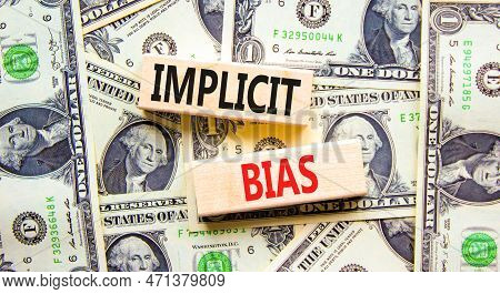 Implicit Bias Symbol. Concept Words Implicit Bias On Wooden Block. Beautiful Background From Dollar 