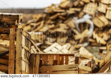 Broken And Used Crates On Landfill. Pile Of Rubish.