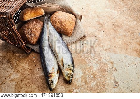 Christianity Background. Loaves Of Bread And Two Fish In A Basket.