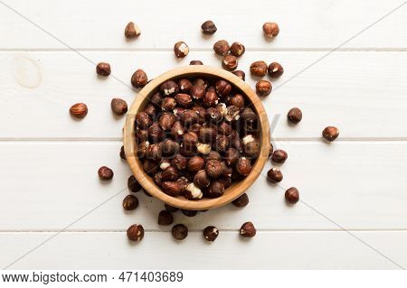 Wooden Bowl Full Of Hazelnuts On Table Background. Healthy Eating Concept. Super Foods.