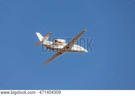 Scenic Close Bottom View Modern Luxury Expensive White Private Jet Plane Dispatching From Airport Is