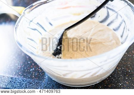 Pancake Batter In A Glass Mixing Bowl.