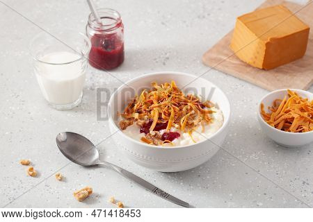 Rice Pudding With Norwegian Brunost Traditional Brown Cheese And Raspberry Jam