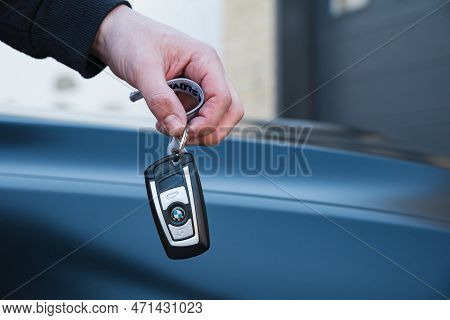 Slovenia, Ljubljana - 31 January 2023: Bmw M4 High Performance Car With Hand Holding Key