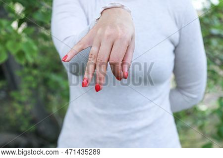 Mockup Photo For Unidentified Middle-aged Woman In White Picking Up Or Throwing Away Something With 