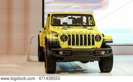 Yellow Rubicon Jeep Car On Display.crowds Looking At New Car Models At Auto Show. National Canadian