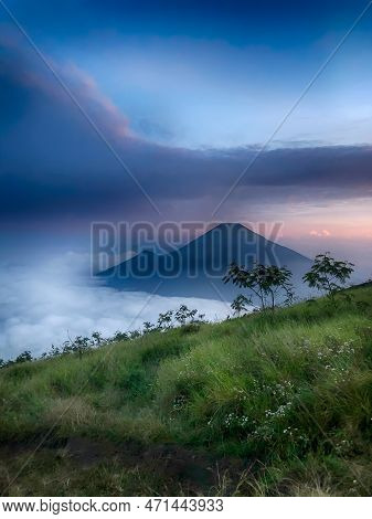 The View From The Summit Of Mount Sindoro, With Mount Sumbing Next To It In The Morning