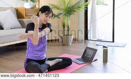 Beautiful healthy woman practicing yoga, Stretch or warm up before exercising, Calming the mind and 