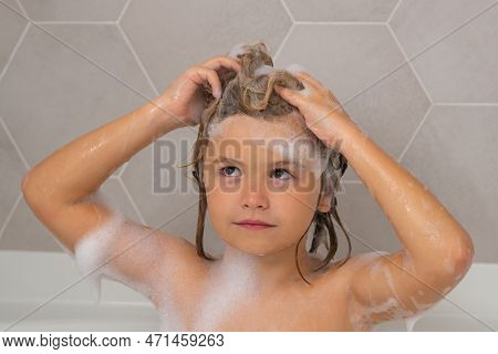 Kid Washing Hair, Bathing. Child In The Bath With Bubbles. Happy Child Enjoying Bath Time. Little Bo