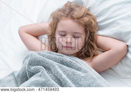 Kid Enjoying Sweet Dreams. Lovely Face Of Blonde Caucasian Child, Sleeping On Bed. Sweet Dreams. Lit