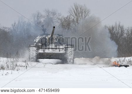 Krasnoye Selo, Russia - February 19, 2023: A Soviet Tank T-54 On The Edge Of A Forest In Heavy Snowf