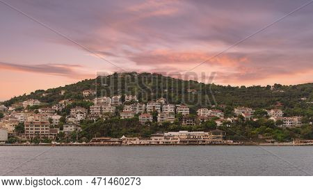 View Of The Mountains Of Kinaliada Island From Marmara Sea, With Traditional Summer Houses And Boats
