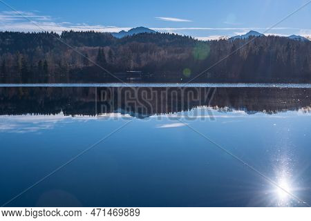 Reflecting Winter Sun At Lake Tuettensee In Bavaria