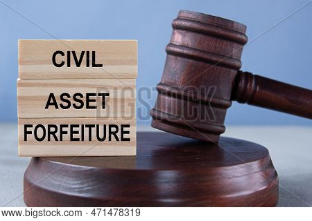 The Words Civil Asset Forfeiture On Wooden Cubes Against The Background Of The Judge's Gavel And Sta