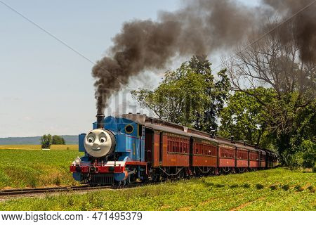 Ronks, Pennsylvania, June 19, 2022- Thomas The Tank Engine Chugs Down The Track Heading For The Stra