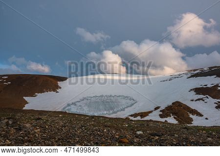 Dramatic Evening Landscape With Huge Rock Mountain With Snowy Mountain Dome In Sunlight At Sunset. B