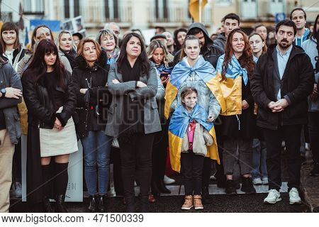 Lisbon, Portugal - February 24, 2023: A Group Of Protesters, Mostly Women, Stand Tall With Unwaverin