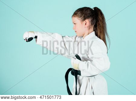 Sport Success In Single Combat. Practicing Kung Fu. Happy Childhood. Little Girl In Gi Sportswear. S