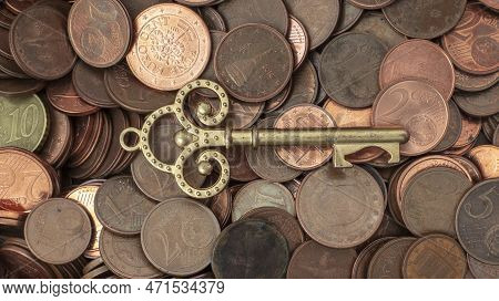 Euro Cents With An Ancient Key. Money Opens Many Doors. Ancient Key On Coins