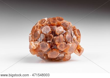 Radiating Group Of Prismatic Crystals Of Raw Aragonite Mineral Gem Stone On Grey Background With Sha
