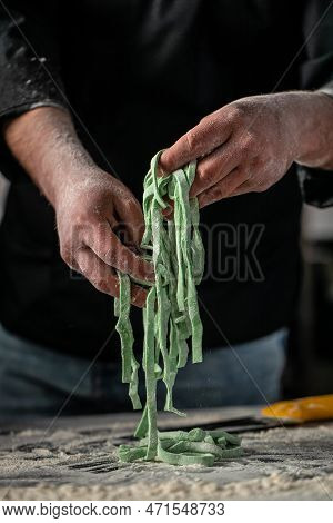 Chef Makes Fresh Spaghetti, Fettuccine Or Tagliatelle. Cooking Process.