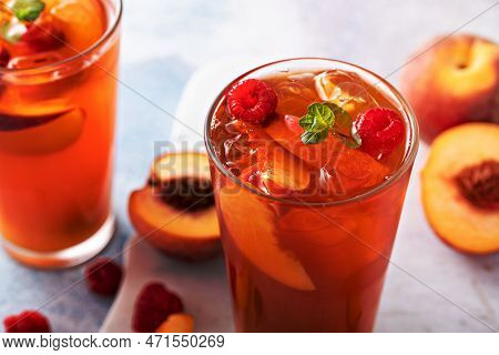 Peach And Raspberry Iced Tea Or Cocktail, Cold And Refreshing Summer Drink