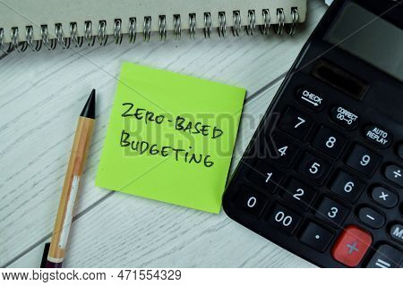 Concept Of Zero-based Budgeting Write On Sticky Notes Isolated On Wooden Table.