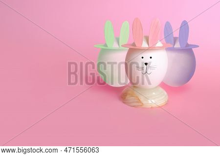 Easter Eggs With Rabbit Ears On Pink Background