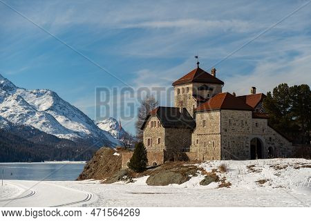 Silvaplana, Switzerland, February 21, 2023 Historic Old Castle Crap Da Sass At The Lake Of Silvaplan