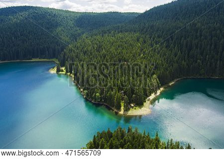 Montenegro. Zabljak. Durmitor National Park. Popular Tourist Spot. Black Lake Surrounded By Green Co