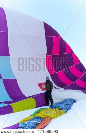 A Man Standing In Front Of A Balloon. Taken At 42nd International Balloon Festival In Chateau D'oex 