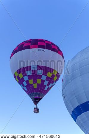 A Balloon Rising In The Air. Taken At 42nd International Balloon Festival In Chateau D'oex In Januar