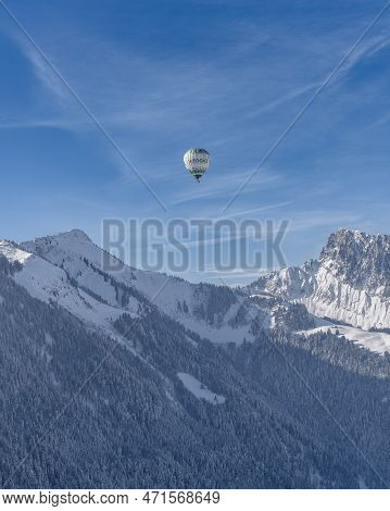 A Balloon Hanging In The Sky Over The Swiss Alps. Taken At 42nd International Balloon Festival In Ch