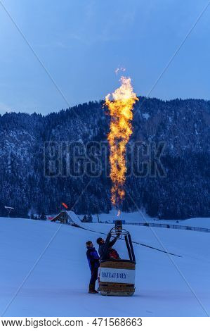 Two Men Testing A Burner. Taken At 42nd International Balloon Festival In Chateau D'oex In January 2