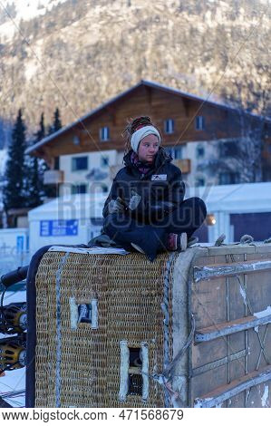 A Pilot Waiting On The Basket Of A Balloon For The Weather To Clear. Taken At 42nd International Bal