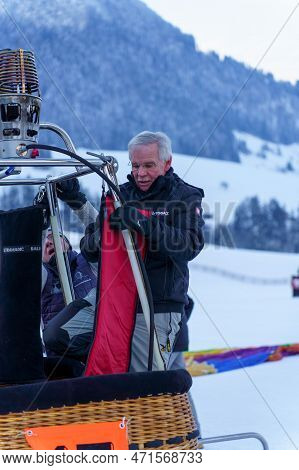 A Man Fixing A Balloon To Its Basket. Taken At 42nd International Balloon Festival In Chateau D'oex 