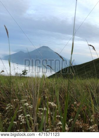 The View From The Summit Of Mount Sindoro, With Mount Sumbing Next To It In The Morning