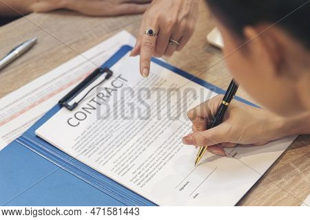 Close Up Team Businesswoman Hands Partners Sign Contract With Success Business Deal. Diversity Busin