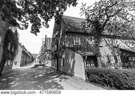 Augsburg, Germany - April 29, 2015: The Fuggerei Is The Worlds Oldest Social Housing Complex Still I
