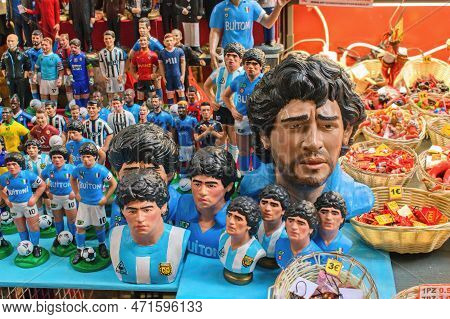 Naples, Italy-  28.3.2022: Traditional Street Souvenirs, Miniatures Of Famous D. A. Maradona And Oth
