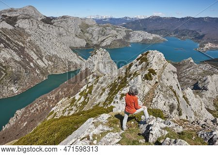 Picturesque Reservoir And Mountain Landscape In Riano. Hiker. Spain