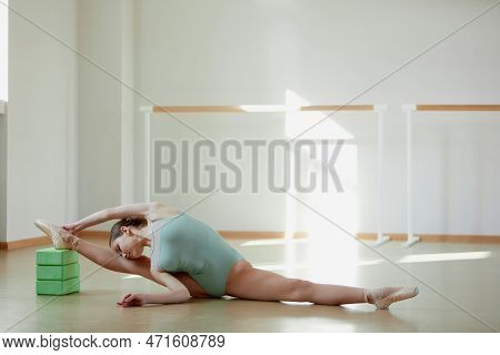 Professional Performer. Tender Teen Girl, Ballerina Training In Ballet School On Daytime. Stretching