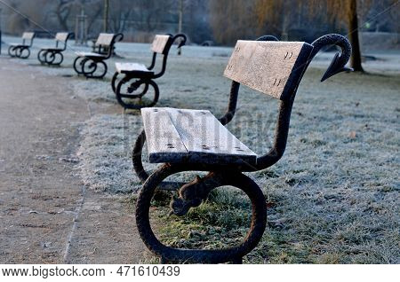 Snake Bench, The Park Bench Frame Creates A Cast Iron Casting Of A Dragon Or Snake With An Arrow Or 