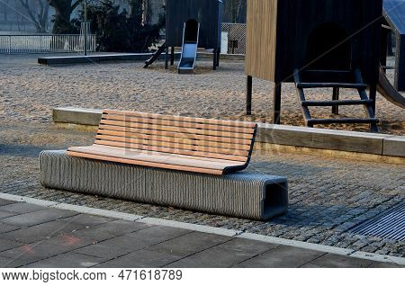 Park Bench Has A Concrete Tube Base Flattened On The Sides. The Bench Is Printed On A 3d Printer Fro