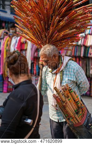 Kathmandu, Nepal, 04 23 2022: Portrait Of A Man Selling Incense