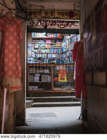 Kathmandu, Nepal, 04 23 2022: A Man Sitting In His Book Store In Kathmandu