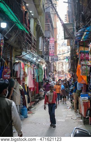 Kathmandu, Nepal, 04 23 2022: A Child Walking Through Kathmandu Bazaar