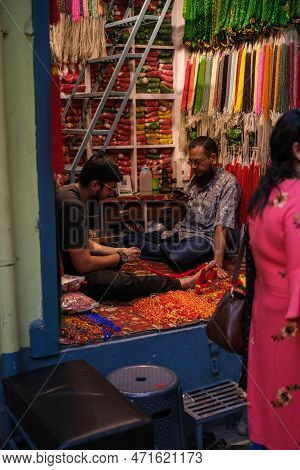 Kathmandu, Nepal, 04 23 2022: A Man Sitting In His Booth On Kathmandu Bazaar