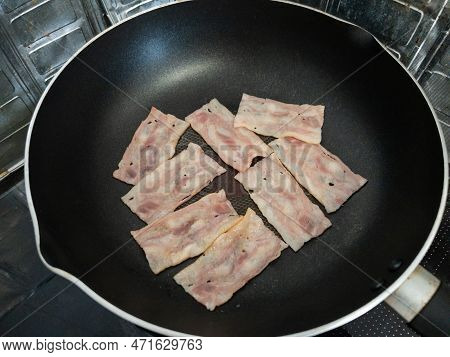 The Smoked Bacon Grilled On The Non-stick Pan For The Breakfast In The Urban Kitchen, Front View Wit