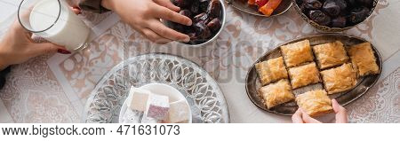 Top View Of Muslim Mother And Kids Having Breakfast During Suhur At Home, Banner.